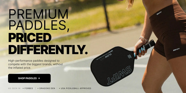 A person outdoors holding a black pickleball paddle with large white SWIFT branding. Large promotional text on the left reads 'PREMIUM PADDLES, PRICED DIFFERENTLY.
